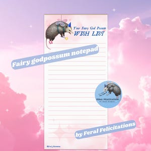May include: A notepad with a whimsical design featuring a possum with fairy wings and a wand. The notepad has the text "Your Fairy God Possum WISH LIST" and "Fairy godpossum notepad". A round sticker with a possum illustration is also included.