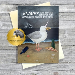 May include: Greeting card with a whimsical illustration of a seagull with a horn, pizza, and bottles on a beach. The text reads "Blimey the elusive Nargull has shimmered before yer eyes!" and "Feral Felicitations".