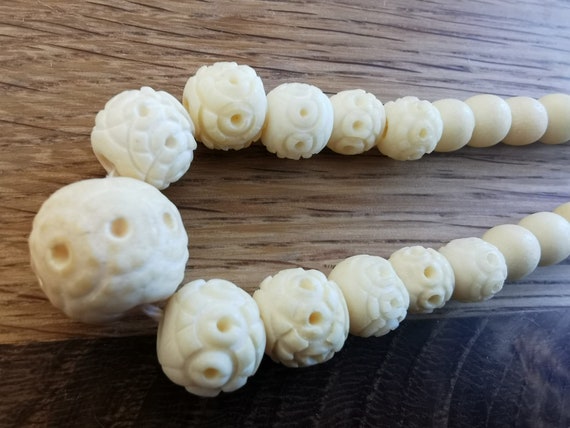 Antique short necklace of carved bone beads strun… - image 1