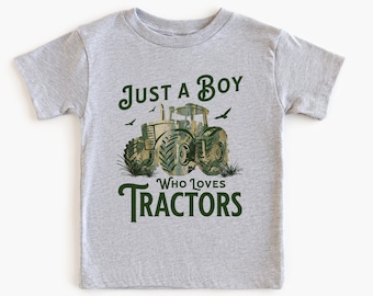 May include: A gray t-shirt with a green camouflage tractor graphic and the text "Just a Boy Who Loves Tractors".
