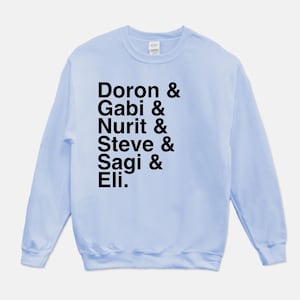 May include: Light blue sweatshirt with black text that reads "Doron & Gabi & Nurit & Steve & Sagi & Eli."