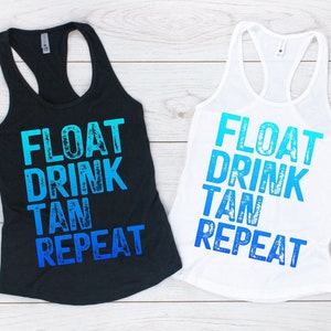 May include: Two tank tops with the text "FLOAT DRINK TAN REPEAT" in a blue gradient. The tank tops are on a white wooden background.