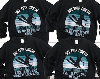 May include: Four black sweatshirts with a ski trip crew design. Each sweatshirt features a skier in a retro sunset graphic with text that reads "Ski Trip Crew" and a different ski-related phrase. The phrases are "Most Likely to Be Up to Snow Good", "Most Likely to Be Sippin' Down the Slopes", "Most Likely to Face Plant and Make it Look Cool", and "Most Likely to Eat, Sleep, Ski, Repeat".