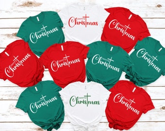 May include: Nine t-shirts in red, white, and green with the text "merry christmas" and a cross printed on them.