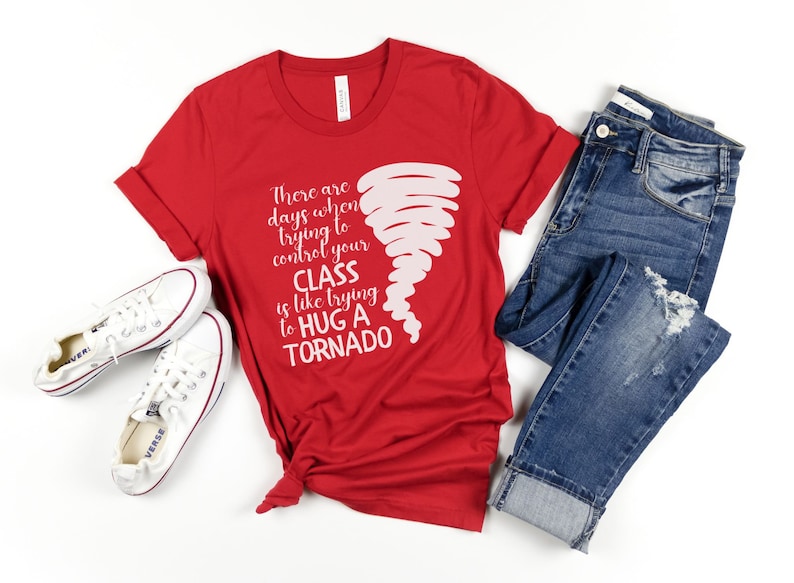 May include: Red t-shirt with a white graphic of a tornado and the text "There are days when trying to control your CLASS is like trying to HUG A TORNADO".