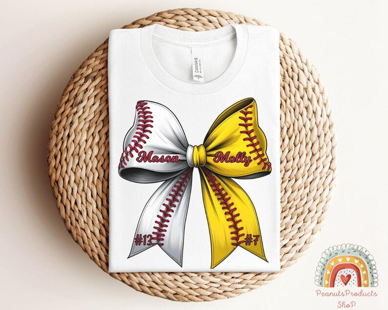 May include: White t-shirt with a yellow and white softball bow with red stitching. The bow has the names "Mason" and "Molly" written on it, and the numbers "#13" and "#7" on the bottom.