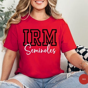 May include: Red t-shirt with black block lettering that says "IRM Seminoles".