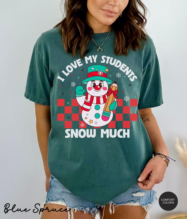 May include: A teal blue t-shirt with a snowman holding a pencil and the text "I love my students snow much".