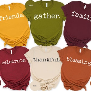 May include: Six t-shirts in various autumn colors with white text. The shirts read "friends", "gather", "family", "celebrate", "thankful", and "blessing".