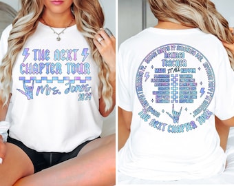 May include: White t-shirt with a graphic design that says "The Next Chapter Tour" with a checkered pattern and the text "Mrs. Jones 2024". The back of the shirt has a graphic design of a circle with the text "Some days it rocked me, either way I'm retired teacher, made it all happen" and a list of words including "planning, training, facilitating, enforcing, assessing, monitoring, guiding, organizing, organizing, advocating, adapting, supporting, engaging, inspiring". The graphic design also includes a checkered pattern and the text "The Next Chapter Tour".