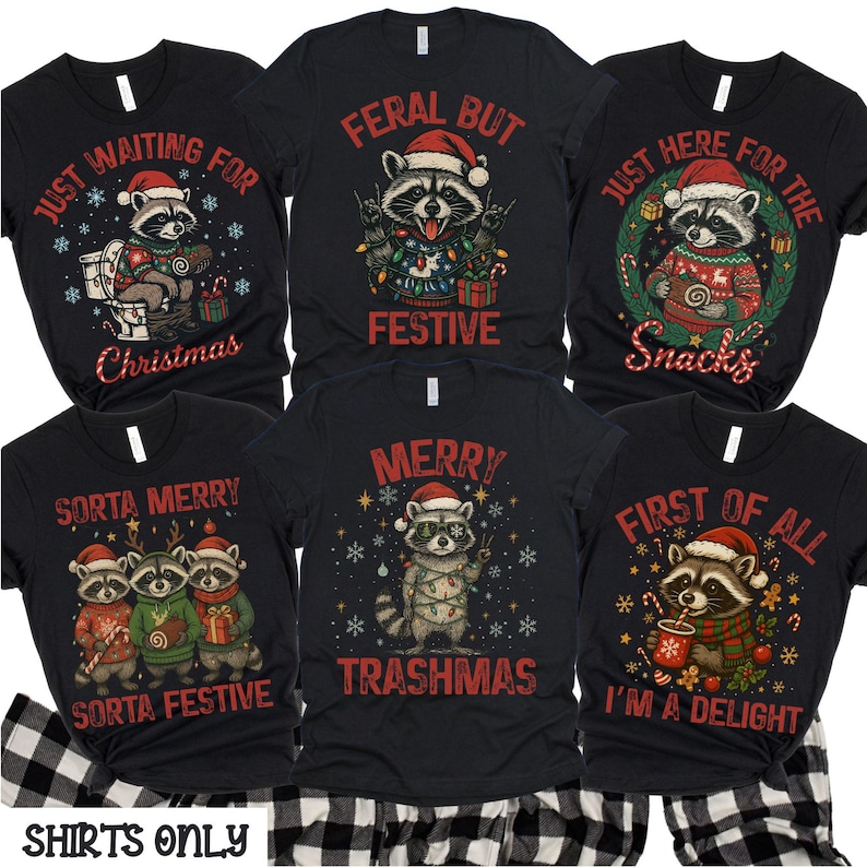 May include: Black graphic t-shirts with Christmas raccoon designs. The shirts feature raccoons wearing Santa hats and festive sweaters, with text like "Just Waiting for Christmas" and "Merry Trashmas."