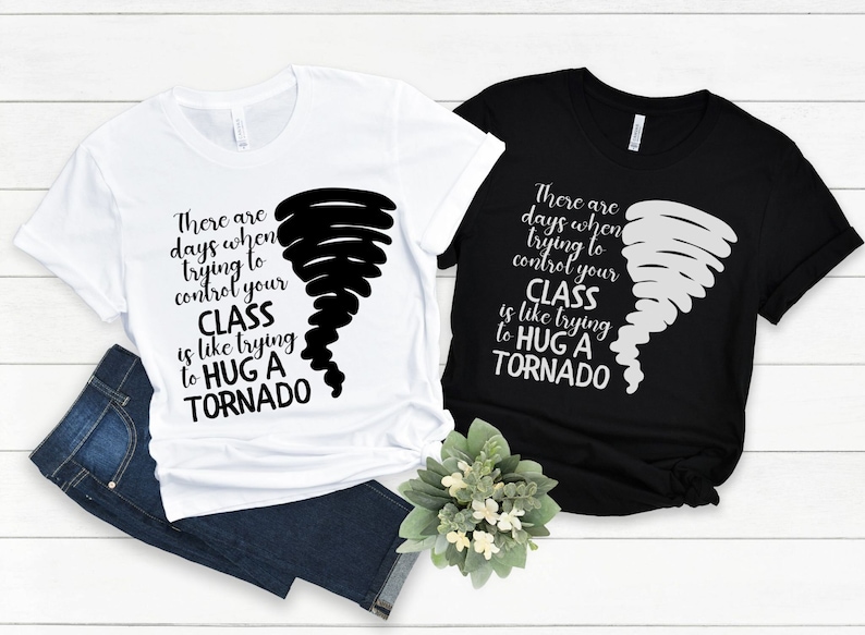 May include: Two t-shirts with a black and white tornado graphic and the text "There are days when trying to control your class is like trying to hug a tornado".