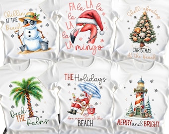 May include: White t-shirts with various holiday-themed graphics. Designs include a snowman at the beach, a flamingo in a Santa hat, a Christmas tree made of seashells, a palm tree, Santa on a beach chair, and a lighthouse. Text includes "Chillin' at the Beach" and "Merry and Bright."