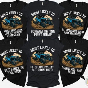 May include: Black t-shirts with various phrases and a blue off-road vehicle graphic. Phrases include "Most Likely To Make Mud Look Like a Fashion Statement" and "Drink All The Beer".