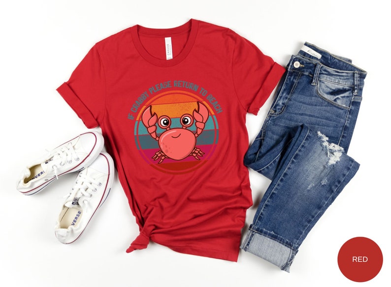 May include: Red t-shirt with a retro-style graphic of a crab with the text "If Crabby Please Return to Beach".