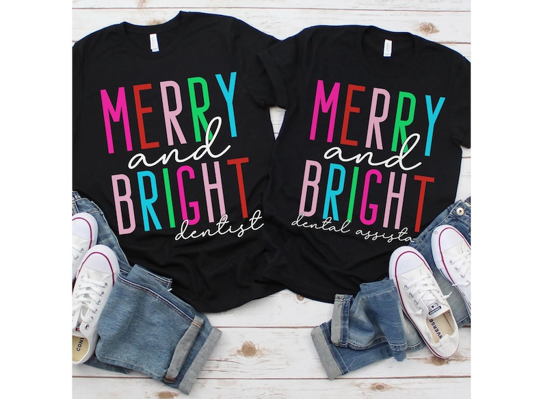 May include: Two black t-shirts with the text "Merry and Bright" in colorful letters. One shirt says "dentist" and the other says "dental assistant".