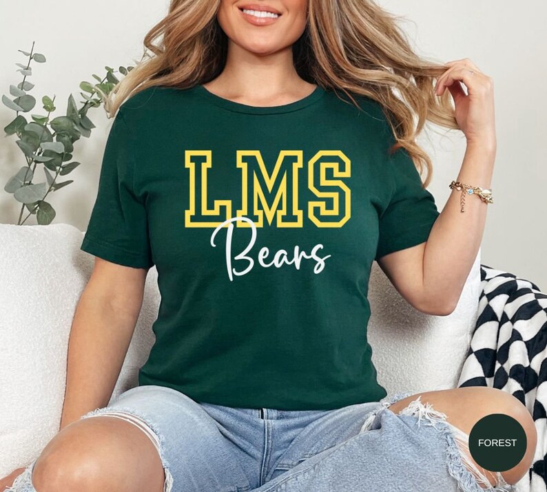 May include: A green t-shirt with the text "LMS Bears" in yellow and white lettering.