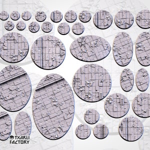 May include: A set of 20 round and oval-shaped, grey, textured plastic gaming bases. The bases have a grid pattern and are designed to represent a futuristic, urban environment.