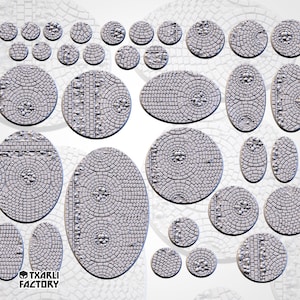 May include: A set of 18 round and oval-shaped miniature gaming bases with a cobblestone design. The bases are made of a light grey material and have a textured surface.