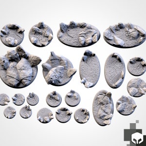 May include: A set of 17 grey resin miniature bases for tabletop gaming. The bases are in various shapes and sizes, including round, oval, and irregular shapes. Some bases feature raised details, such as rocks and runes.