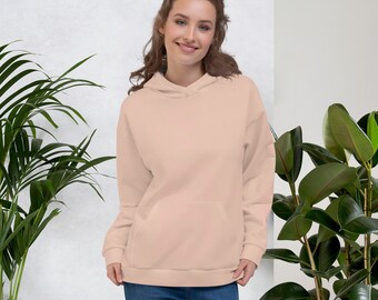 May include: A light pink hooded sweatshirt with a kangaroo pocket. The sweatshirt is made of a soft, comfortable fabric.