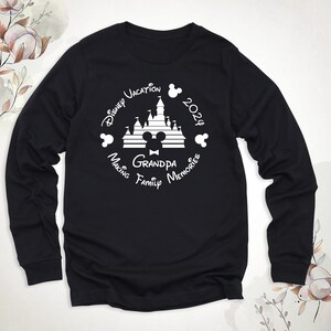 May include: Black long-sleeve shirt with a white graphic of Mickey Mouse's head, the Disney castle, and the text "Disney Vacation 2023 Making Family Memories Grandpa".