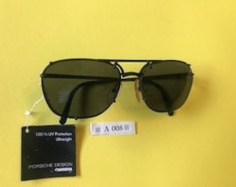 Porsche Design by Carrara 5647 .90 "brand new" classic sunglasses Discounted  flat black frame dark lenses. Discounted 100.00 dollars