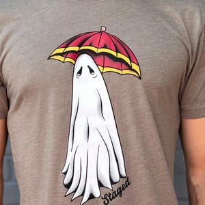 Cute T shirt featuring a ghost with an umbrella.