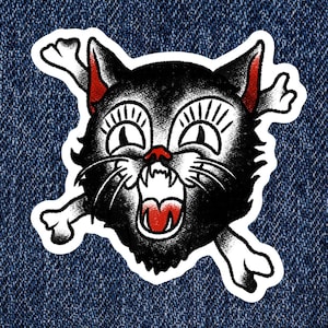 May include: A black and white illustration of a cat's head with a menacing expression, surrounded by two white bones. The cat's eyes are wide open, and its mouth is open in a snarl. The illustration is in a traditional tattoo style.