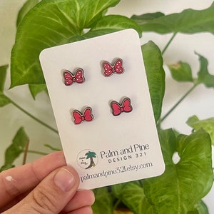 May include: Four red and white polka dot bow earrings on a white card with the text "Palm and Pine DESIGN 321 palmandpine321.etsy.com".