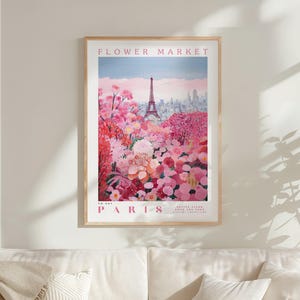 a framed poster of a flower market in Paris, with the Eiffel Tower visible in the background.