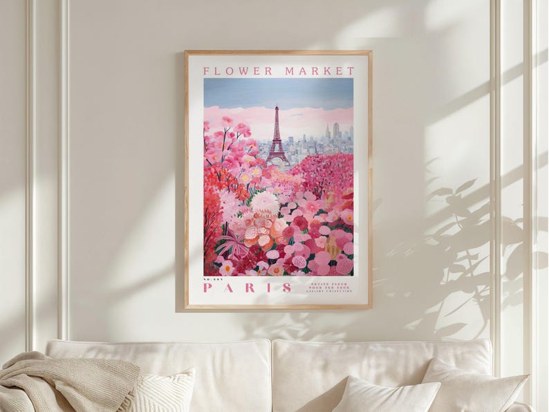 a framed poster of a flower market in Paris, with the Eiffel Tower visible in the background.