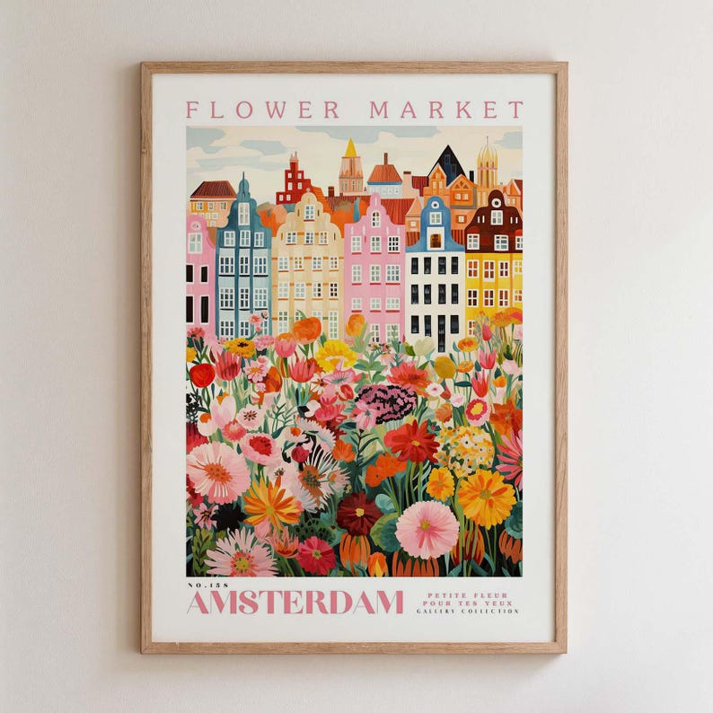 May include: A framed art print titled "Flower Market" featuring a colorful illustration of Amsterdam buildings and a vibrant flower field. The print includes the text "Amsterdam" and "Petite Fleur Pour Tes Yeux Gallery Collection."