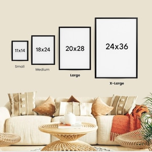 a living room with a white sofa and a coffee table. Above the sofa, there are four framed pictures of different sizes, ranging from 11x14 to 24x36, indicating the dimensions of each picture. The room also has a potted plant and a rug, adding to the cozy and inviting atmosphere.