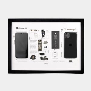 May include: A black-framed display featuring a disassembled iPhone 11, including the front screen, back casing, battery, and internal components arranged on a white background with descriptive text, technical specifications, and the Apple logo.
