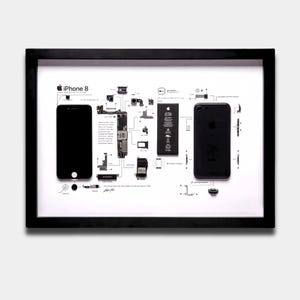 May include: A framed display featuring a disassembled iPhone 8 with its internal components, including the logic board, battery, and camera modules, arranged on a white background with labels and text describing the device's technical features.