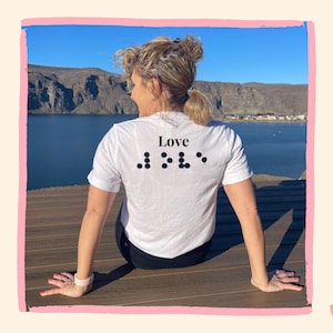 Custom, interlined, raised braille T-shirt (*Interlining is the text ABOVE the braille)