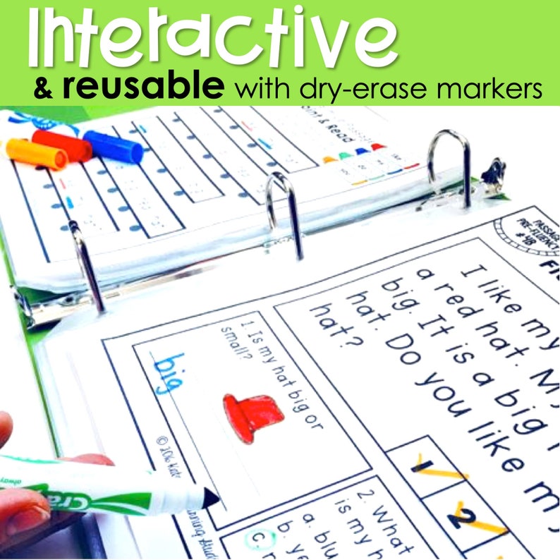 May include: A close-up of a dry-erase activity book with a red hat illustration. The book has a page with the text "Is my hat big or small?" and the word "big" written in blue marker. The book is open and has a binder ring.