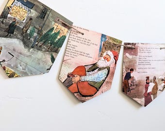 Puede incluir: Una pancarta de papel con temática navideña con tres banderas. Las banderas están decoradas con ilustraciones de un libro infantil. La bandera del centro presenta a un Papá Noel de dibujos animados sentado en una silla. El texto en la bandera dice: "Me levanté esa mañana...Papá Noel."
