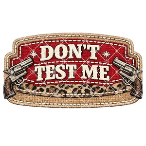 May include: A rectangular design with the words "DON'T TEST ME" in white letters. The design features two revolvers, a red background with a diamond pattern, and a leopard print section.