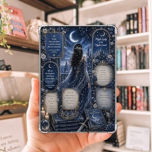 May include: A rectangular protective tablet case featuring a dark blue fantasy illustration of a woman standing on a balcony before a castle under a crescent moon. The design includes floral accents, stacked books, a sword, and various text quotes.