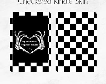 May include: Two Kindle skins with a black and white checkered pattern. One skin features a heart made of skeleton hands with the text "my emotional support kindle". The other skin has a simple checkerboard design.