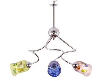 May include: A chrome pendant light fixture with three glass shades. The shades are in blue, green, and pink with a swirl pattern.