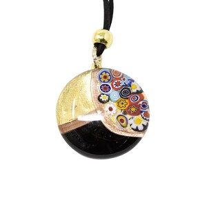 Choker necklace round pendant worked by lampwork in black Murano glass. Decorated with murrine, gold leaf and aventurine. Made by Muma