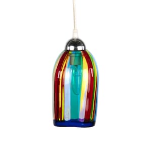 May include: A colorful pendant light with vertical stripes in red, yellow, green, and blue. The glass shade has a rounded shape and a chrome-colored top. The light hangs from a white cord.