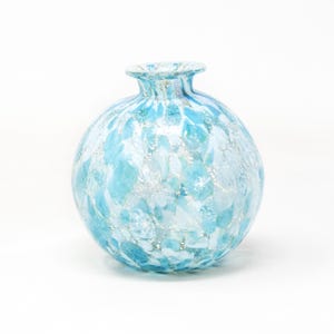 Spherical shaped vase in light blue Murano glass decorated with silver leaf. Made in Italy product by Muma