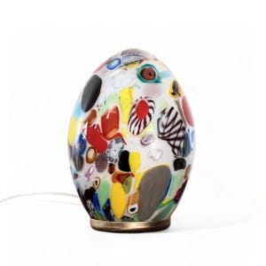 Unique Egg-shaped table lamp in handmade Murano artistic glass, white color decorated with silver leaf and murrine, Made in Italy product