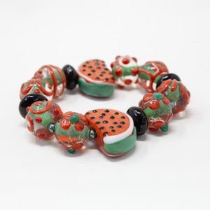 Handmade bracelet with Murano Glass beads with colorful artistic decorations with fruits and flowers, Made in Italy jewelry