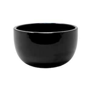 May include: A glossy black bowl with a rounded shape. The bowl has a smooth, reflective surface and a wide opening. The interior is also black, creating a cohesive and minimalist design. This bowl is suitable for serving food or as a decorative item.