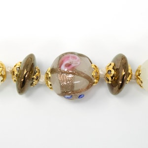 Handmade necklace with round Murano glass beads in white and gold color, adjustable closure, Made in Italy jewel
